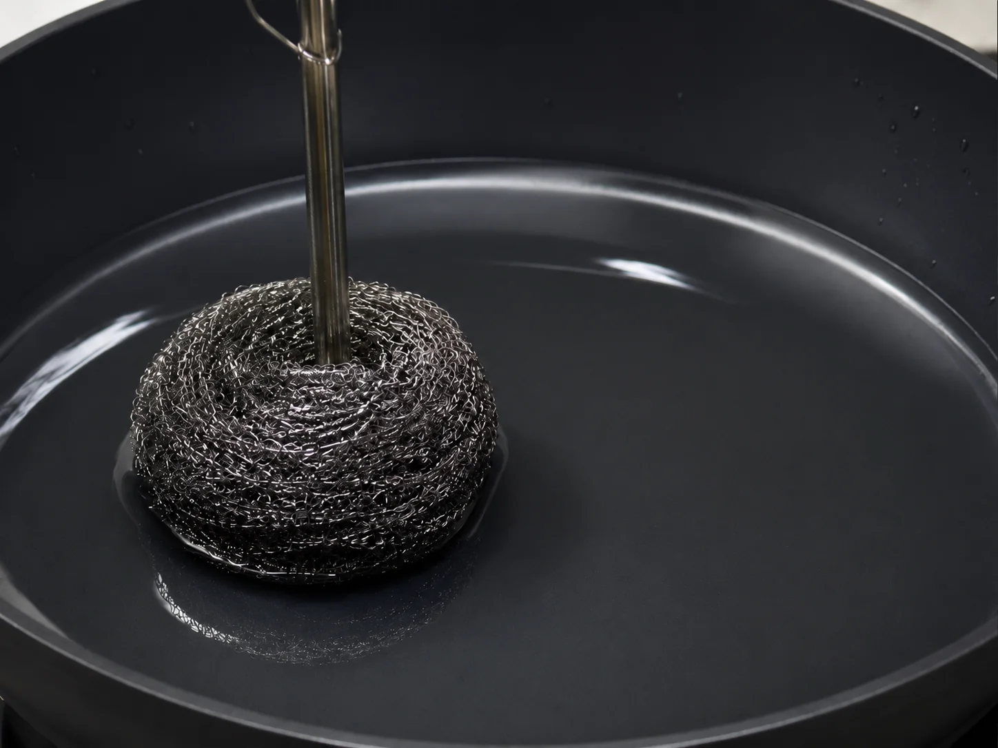 Wet abrasion test using a stainless steel scrubber